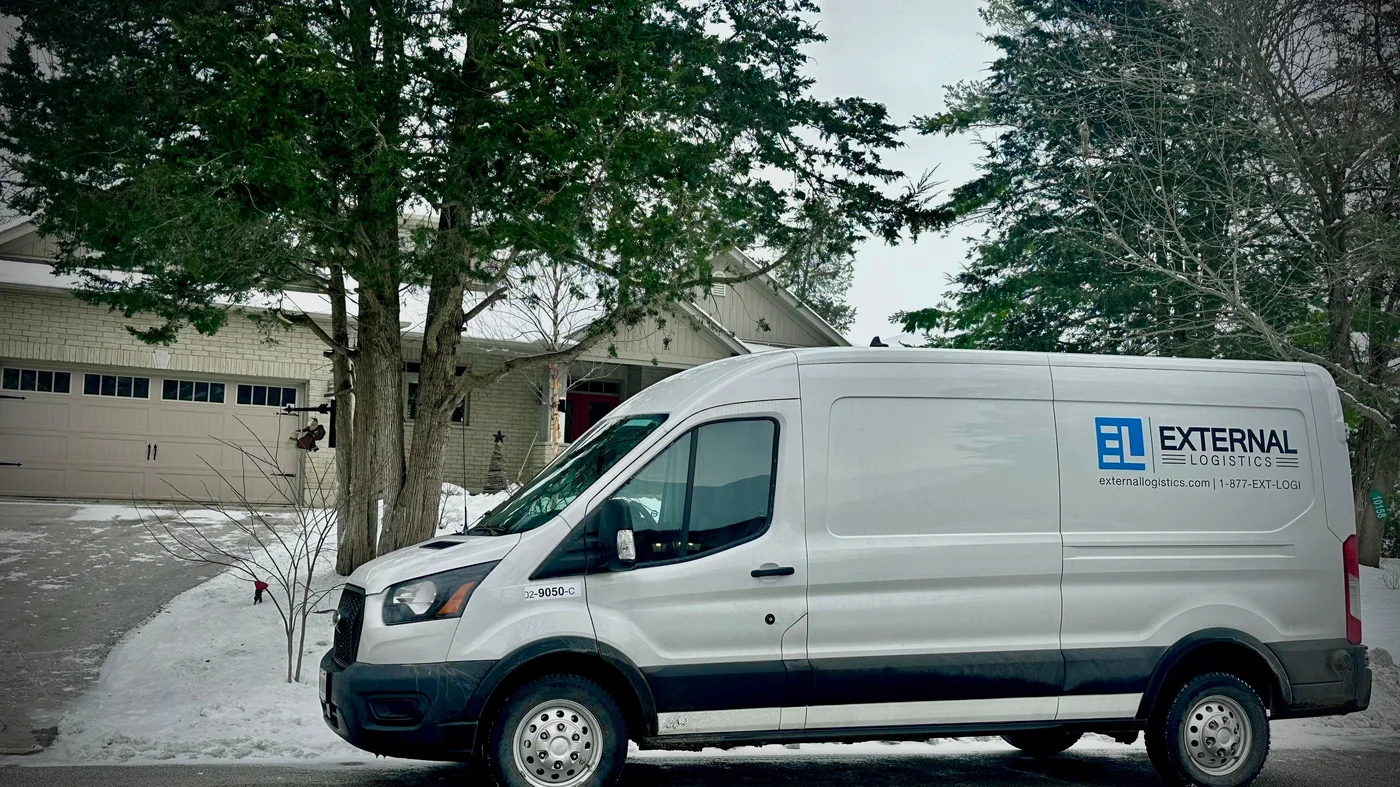 External Logistics cargo van parked at a residential delivery stop